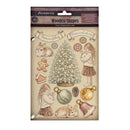 Stamperia Wooden Shapes clear stamp sheet featuring Christmas-themed illustrations including a decorated tree, ornaments, a rabbit, a girl, a gingerbread man, a bell, and banners with phrases on a beige background.
