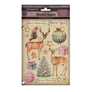 Stamperia 'Winter Dreams' wooden shapes stamping card featuring Christmas-themed illustrations including deer, a cat, ornaments, gifts, stars, and a small Christmas tree on a beige background.