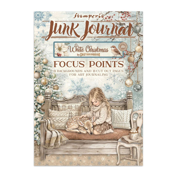 A stampers brand 'Junk Journal' art journal cover titled 'White Christmas'. The cover features a vintage illustration of a young girl sitting on a wooden bench next to a sleeping deer, with a decorated Christmas tree, ornaments, and a small table in the background.