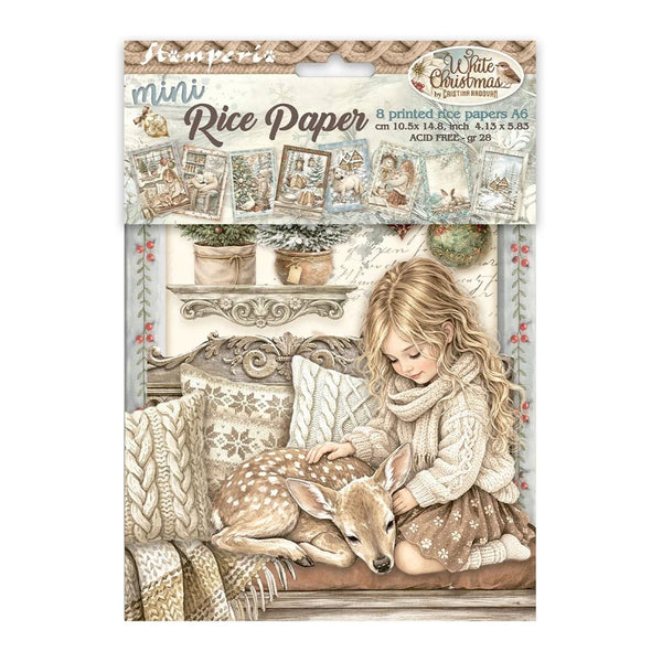 A package of Jamie Perro mini Rice Paper featuring a winter Christmas illustration of a young girl sitting on a couch with a sleeping deer, surrounded by cozy pillows and blankets.
