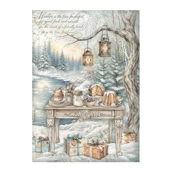 A vintage-style winter landscape illustration featuring a snowy riverside scene with a table set with bread, cakes, and gifts, hanging lanterns, a tree trunk, and cursive text at the top.