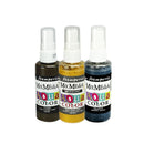 Three small spray bottles of Tim Holten Mix Media Aqua Color ink, shown side by side on a white background. The bottles contain black, gold, and blue ink, with white caps and colorful labels.