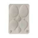 A rectangular silicone mold with six balloon-shaped cavities and two star-shaped cavities, shown on a plain white background.
