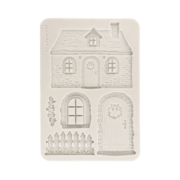 A rectangular silicone mold with embossed house and door designs, shown on a plain white background.