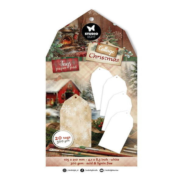 Studio Light Cottage Christmas Tags paper pad containing 20 white paper tags, shown in its retail packaging with festive holiday illustrations.