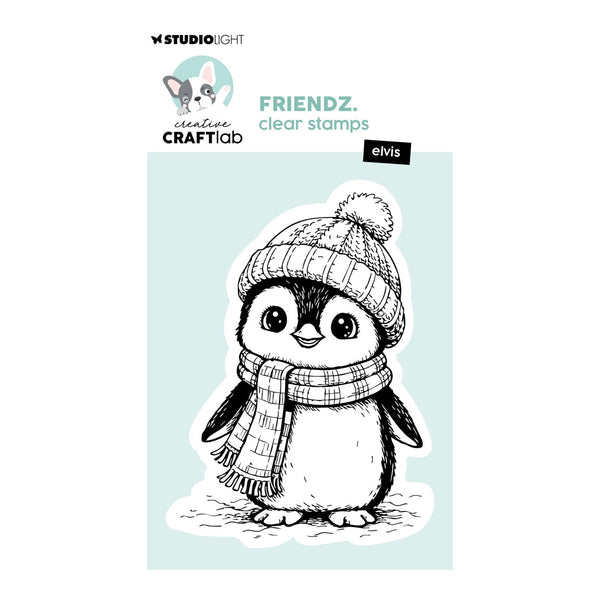 Studio Light Creature Crafted clear stamps featuring the 'elvis' penguin design, shown as a black and white line art illustration wearing a knit beanie and scarf on a light blue background.