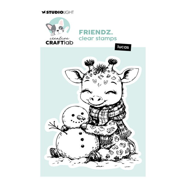 Studio Light Creative Craftlab clear stamps featuring a cute cartoon giraffe named Lucas hugging a snowman, shown on its retail backing card.