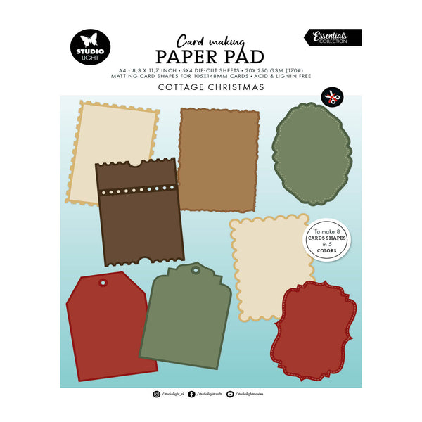 Card making paper pad cover featuring die-cut shapes for making Christmas cards, with a light blue background and sample card shapes in beige, brown, green, and red. Visible brands include Studio Free and Essentials for crafting.