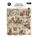 A card making paper pad titled 'Warm Winter' from Studio 45, featuring a collage of cozy winter-themed scrapbook cards and embellishments on a white background.