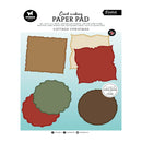 Card making paper pad cover featuring four sample paper shapes in brown, beige, red, and green on a light blue background, with text reading 'Card making PAPER PAD' and 'Cottage Christmas'.