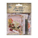 A packaged scrapbook ephemera pack by Jim Holtz Idea-ology, containing 136 vintage-style paper snippets in assorted colors and patterns, sealed in a clear plastic bag with a decorative kraft header card.