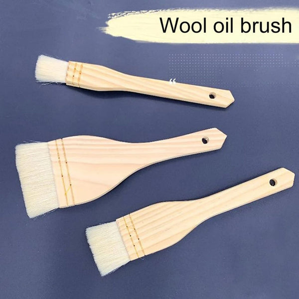 Three wooden-handled wool oil brushes arranged diagonally on a dark blue background, with a cream paint stroke graphic and the text 'Wool oil brush' at the top.