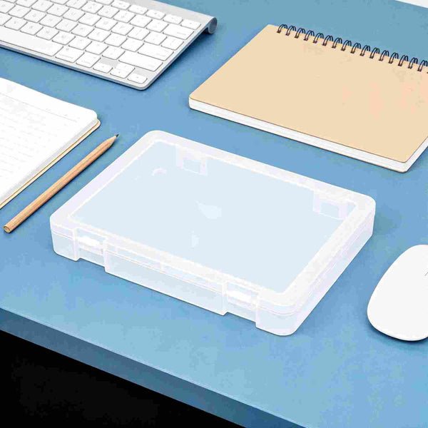 Clear plastic storage box on a blue desk with office supplies.