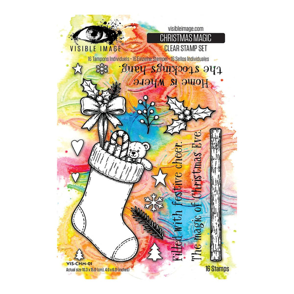 Visible Image Christmas Magic Clear Stamp Set package showing a white Christmas stocking with a teddy bear inside, surrounded by festive watercolor splashes and black line-art stamp designs.
