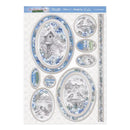 A sheet of decorative scrapbook paper featuring multiple oval and rectangular panels with blue and gray winter bird and birdhouse illustrations, plus floral borders and text elements such as 'Winter Feels Good' and 'Winter Memories.'.
