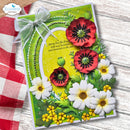 A handmade greeting card featuring layered 3D paper flowers in red, white, and yellow on a bright green background, tied with a sheer white ribbon. The card is displayed on a rustic white wood surface next to a red and white checkered cloth, with an 'Elizabeth craft designs' logo in the top-left corner.