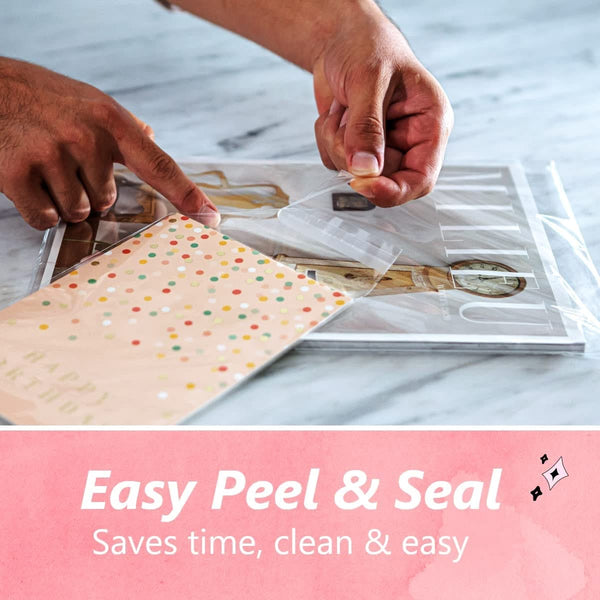 Person applying clear tape to a polka dot envelope with text 'Easy Peel & Seal' on a marble surface.