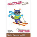 Cottage Cutz die set packaging with a raccoon on skis design.